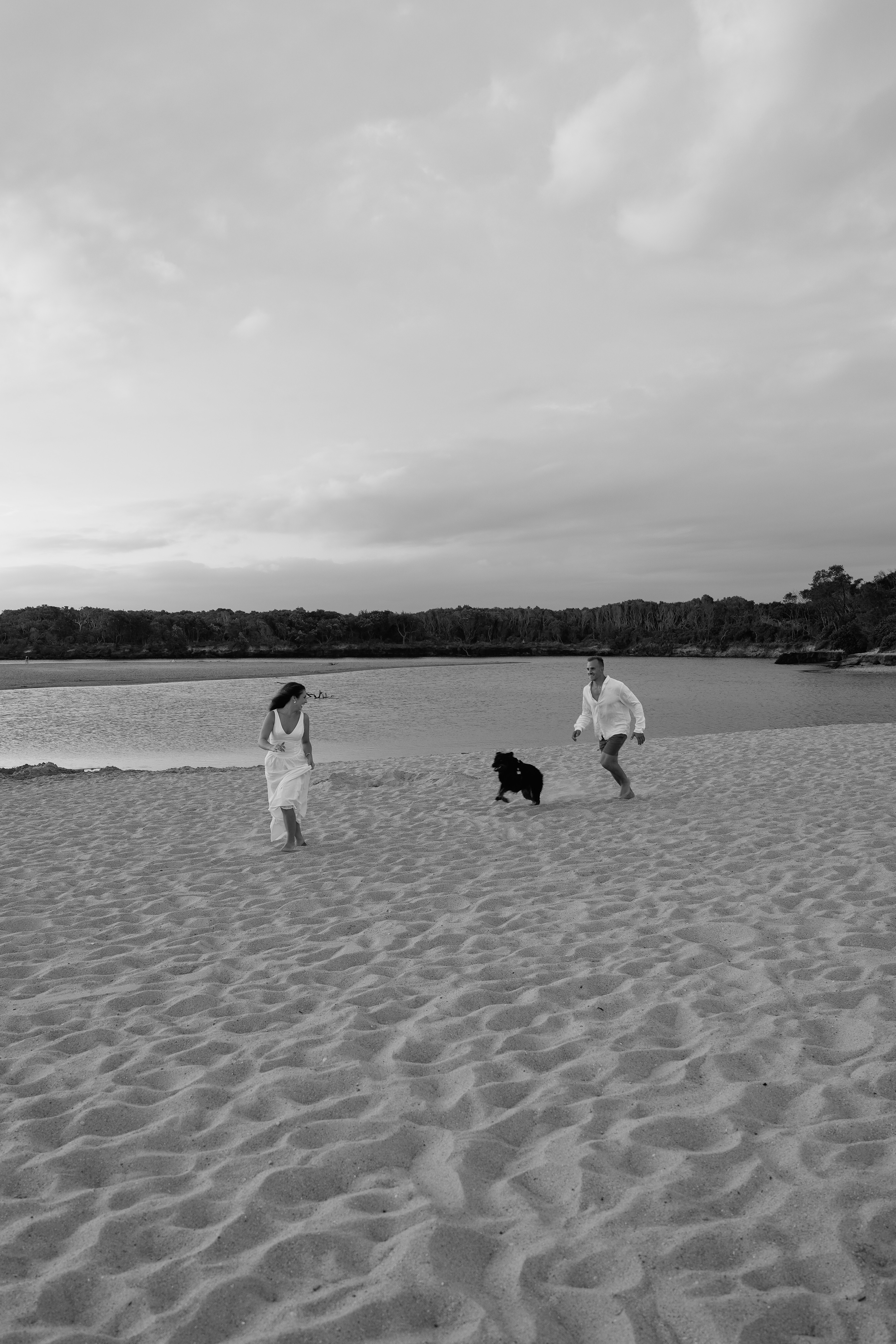Amy and Warner on the beach with their dog